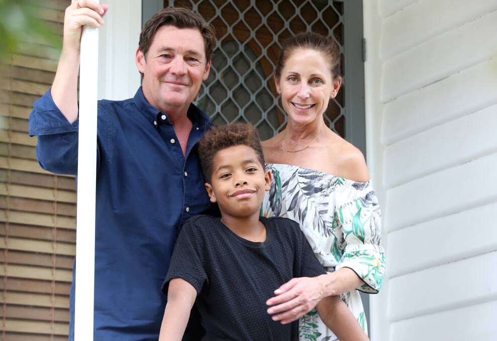 Mike, Addison and Tracy Amor. Mr Amor has called on the government to expedite the process of recognising children adopted by Australian parents as Australian citizens. Picture: GLENN DANIELS