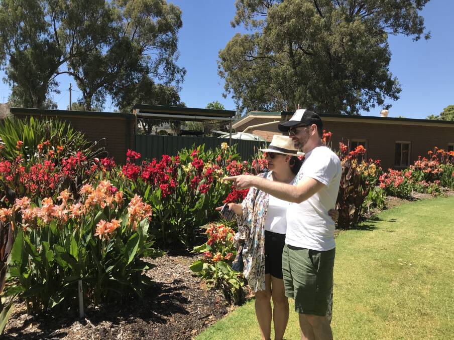 Visitors admire the canna lily collection in the Bendigo Botanic Gardens. Picture: SUPPLIED