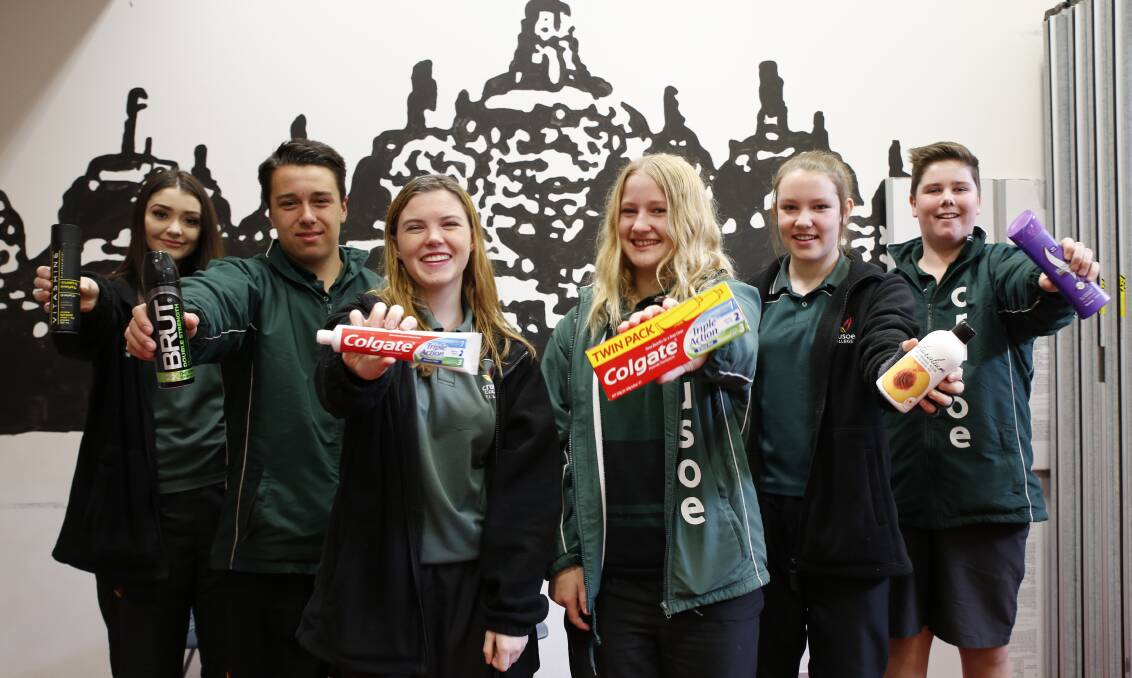 HELPING HAND: Crusoe College students Amanda Rodda, Ethan Fernandes, Jessica Allen, Cynthia Jolley, Jess Maher and Connor Chambers call for donations of toiletries to assist victims of family violence. Donations are being collected at the school. 