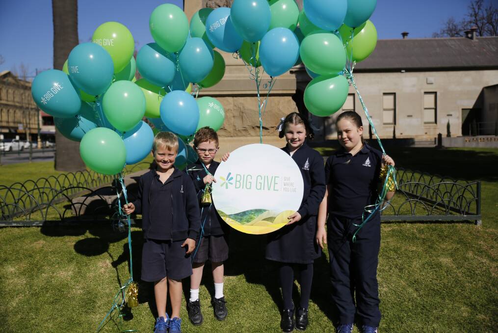 RISING SUPPORT: Camp Hill Primary School students with balloons representing each Big Give campaign. The school is seeking to raise $2000 for a water tank for its cubby corner. Picture: EMMA D'AGOSTINO