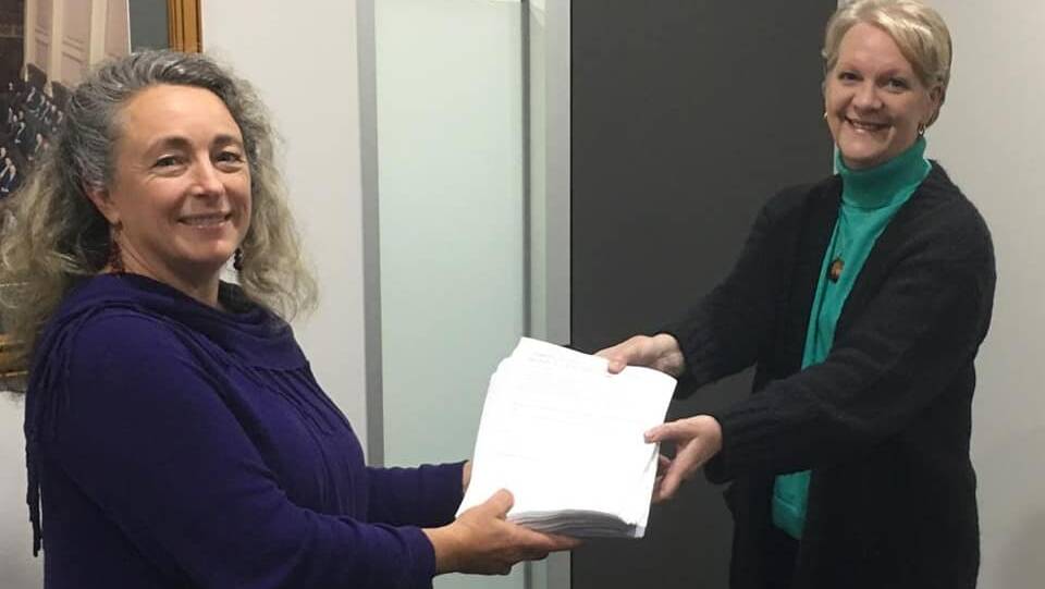 Arabella Davison presents the petition and about 1000 responses to Member for Bendigo West, Maree Edwards. Picture courtesy of Support Birthing at Castlemaine Health