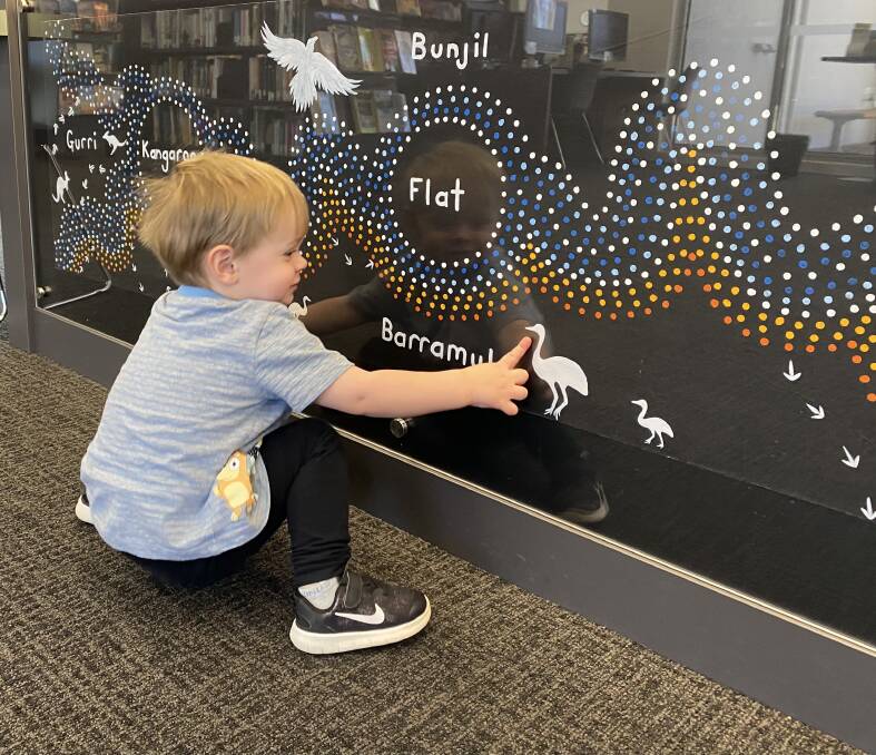 CELEBRATION: A child appreciates the artwork at the Kangaroo Flat Library. Picture: SUPPLIED