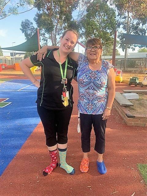 Bendigo Community Health Services early childhood advisor Lara Hassell and family day care co-ordinator Robyn Knight supporting Crazy Socks 4 Docs last year. Picture: SUPPLIED