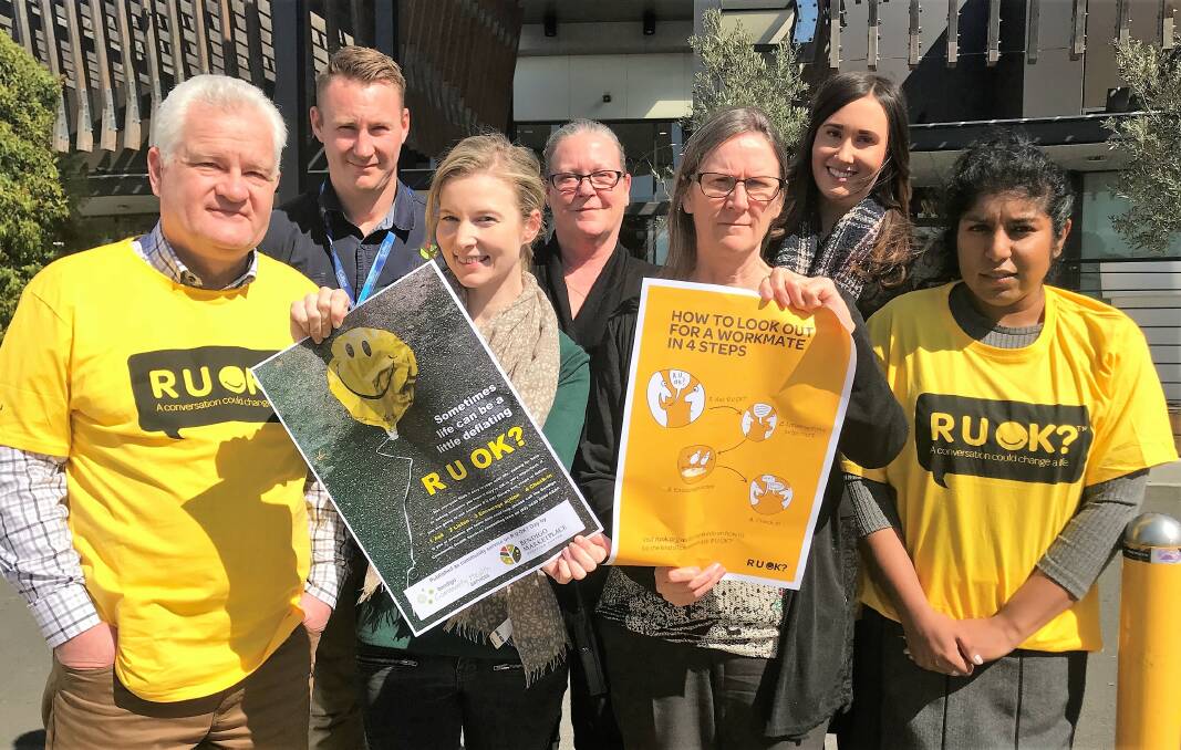 INVITING DIALOGUE: Bendigo Marketplace and Bendigo Community Health Services staff will be promoting the importance of asking R U OK? on Thursday. Picture: SUPPLIED