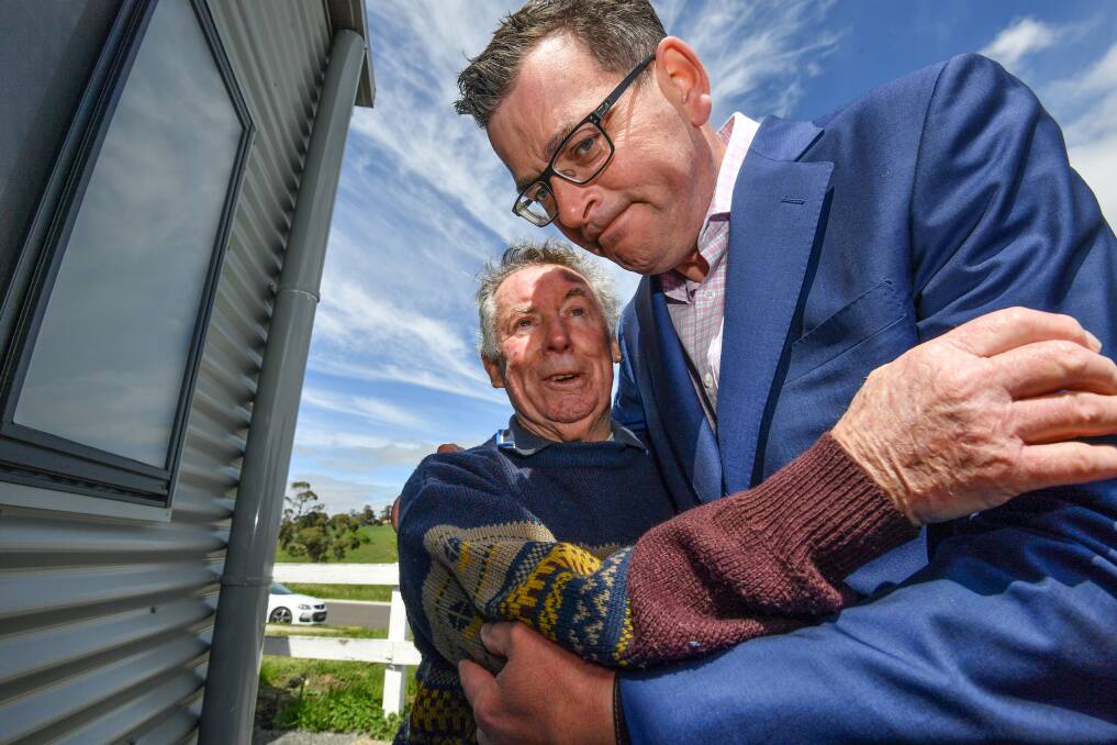 Victorian Premier Daniel Andrews hugs Kyneton Men's Shed member Bob Grubb. Mr Grubb shared his experiences of mental ill health in the 17 years after the death of his grandson, Anthony. Picture: JOE ARMAO