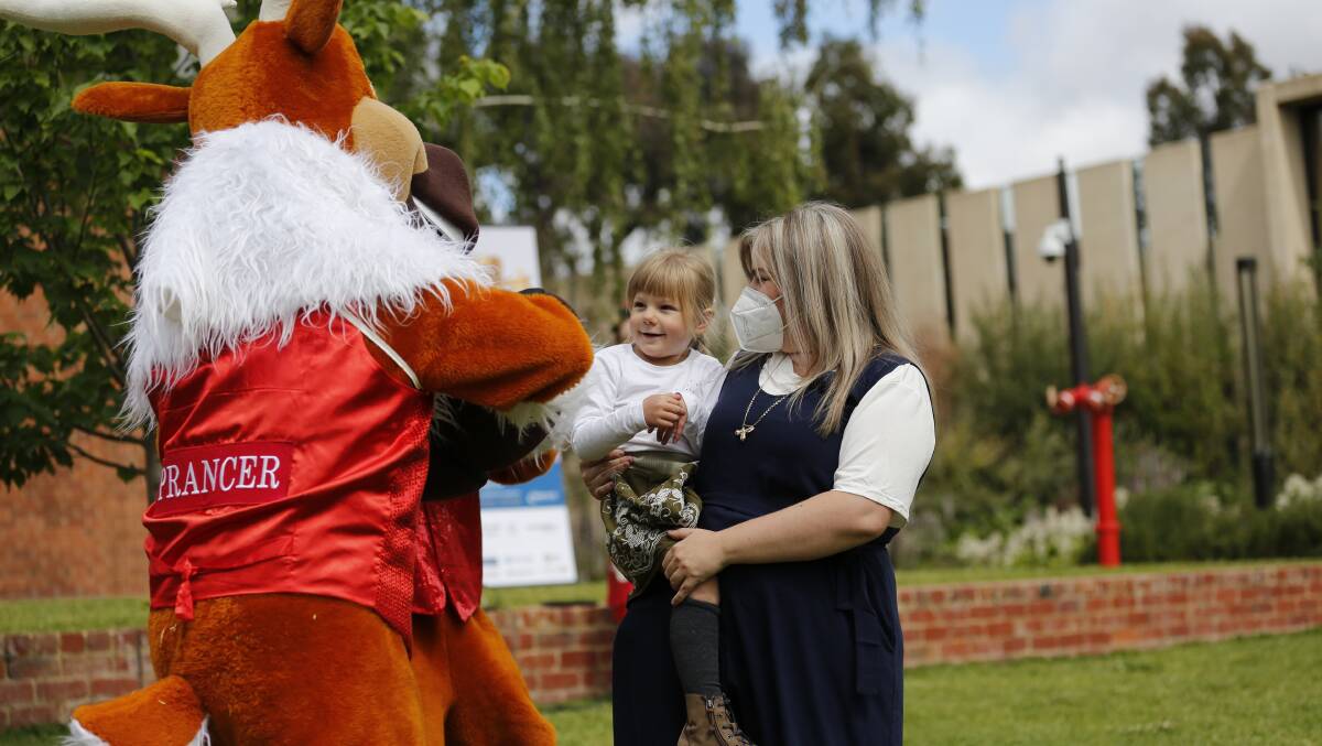 Amelia and mum Jennifer Anne Pinchbeck meet Prancer at the Bendigo Health Christmas Appeal launch. Picture: EMMA D'AGOSTINO