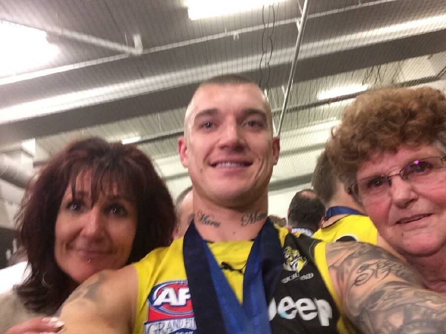 Dustin Martin celebrates with family after winning his first Norm Smith Medal in 2017. Picture: SUPPLIED 