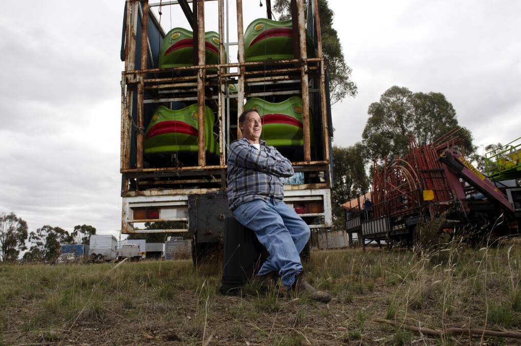 TOUGH TIMES: Robert Phillips beside the carts for a ride packed away on another of the trucks in a central Victorian paddock. Picture: DARREN HOWE