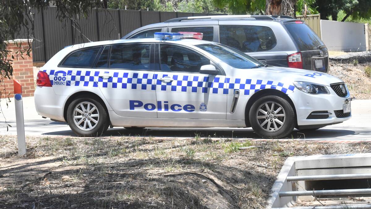 Police attend an address on the Calder Highway, where a man was arrested after fleeing the scene of a drug raid. Picture: DARREN HOWE