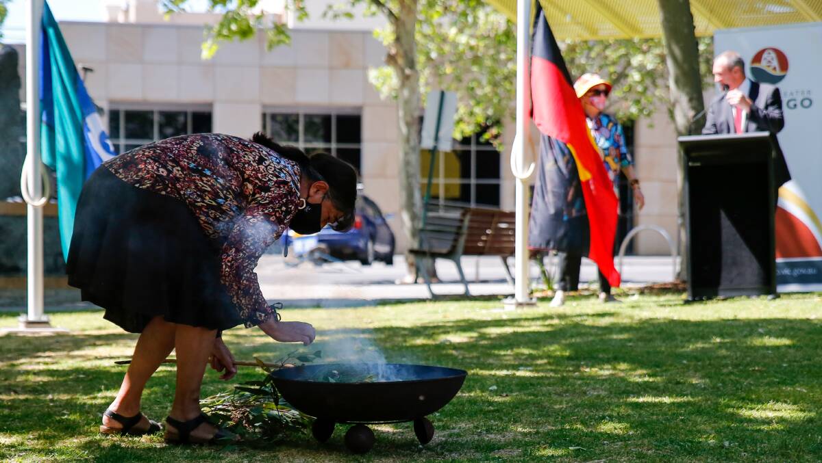 Aunty Marilyne Nicholls conducting the smoking ceremony. Picture: EMMA D'AGOSTINO