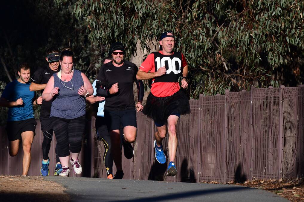 Bendigo parkrun participants head for the end of the route. A bib indicates Andrew Snell is achieving a milestone - his 100th run. Picture: NONI HYETT