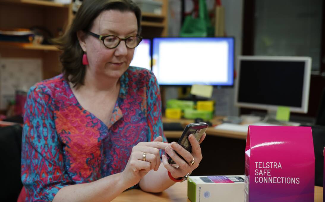 TECH SAVVY: WESNET SafetyNet Australia national director Karen Bentley with a safe phone, which will help protect women from technology abuse. Picture: EMMA D'AGOSTINO
