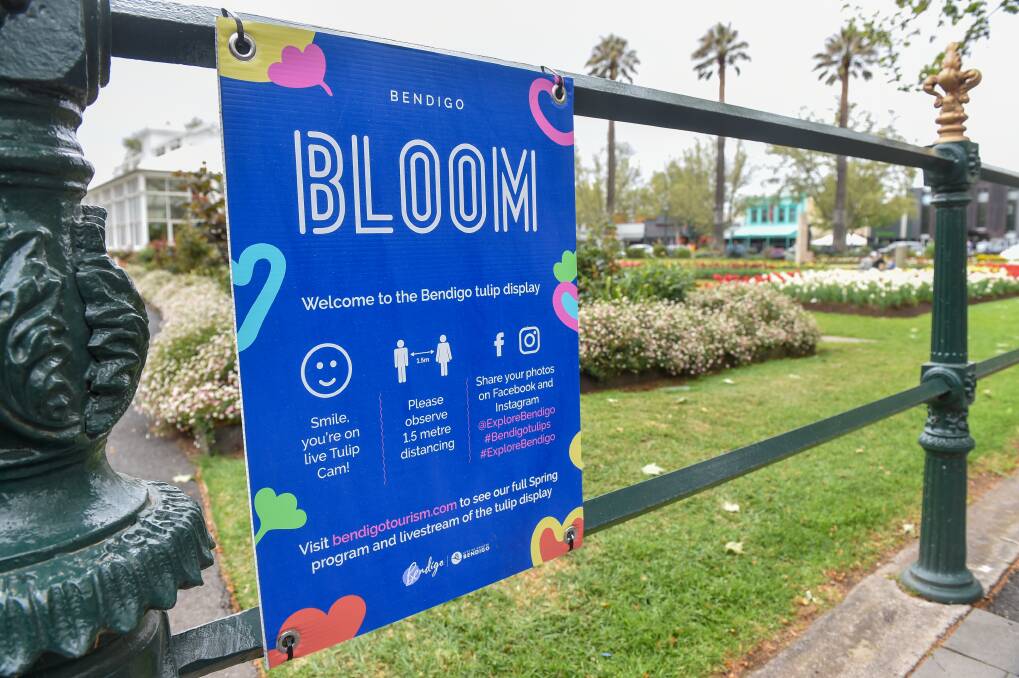 Signs at each of the access points to the conservatory gardens notify people of filming. They say "smile - you're on live tulip cam". Picture: DARREN HOWE