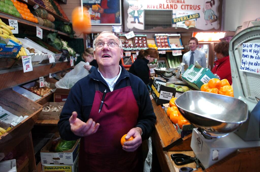 Norm Quin in his shop, Quin's Bluebird, in 2005. Picture: BRENDAN McCARTHY
