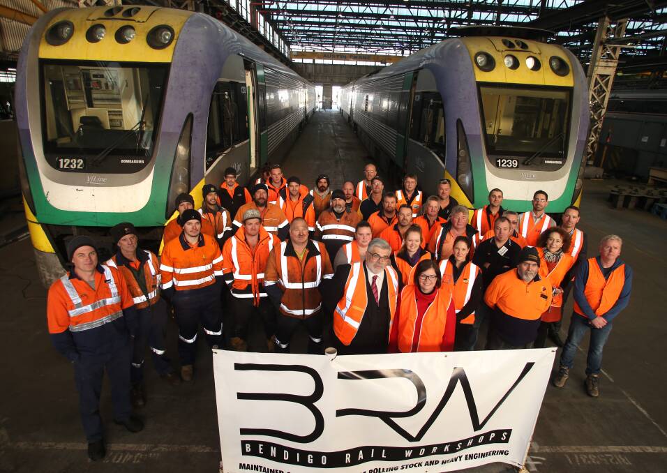 Senator the Hon Kim Carr and Federal Member for Bendigo, Lisa Chesters, make an announcement regarding manufacturing. Pictured at Bendigo Rail Workshops with workers and workshop manager Allan Nicholson. Picture: GLENN DANIELS
