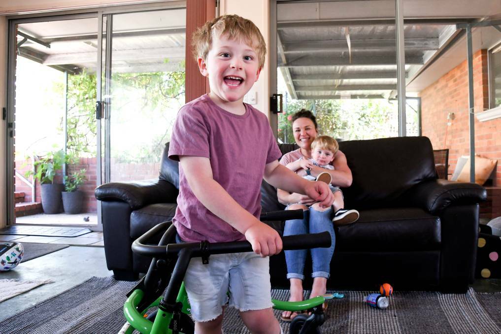 Austin Vearing, 3, with mum Kat and brother Shelby in their Castlemaine home. Picture: NONI HYETT 