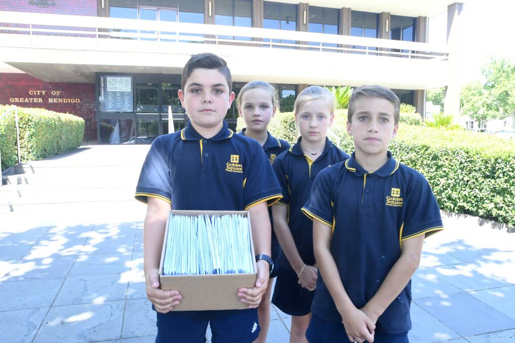 Golden Square Primary School students Tarrant Gloury, Zahli Waugh, Mia Polsen and Liam Hanley present the box of letters to the council. Picture: NONI HYETT