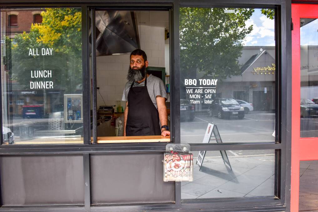 ROUGH START: Awais Chaudry at his Queen Street business, BBQ Today, which only opened 11 days ago. Despite the challenges the business is facing, Mr Chaudry has offered to feed those in need. Picture: BRENDAN McCARTHY