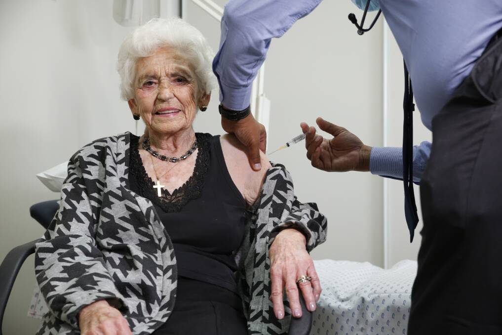 Pat Henshall, 96, becomes the first patient to have a COVID-19 vaccine administered at Flora Hill Medical Centre. Picture: EMMA D'AGOSTINO