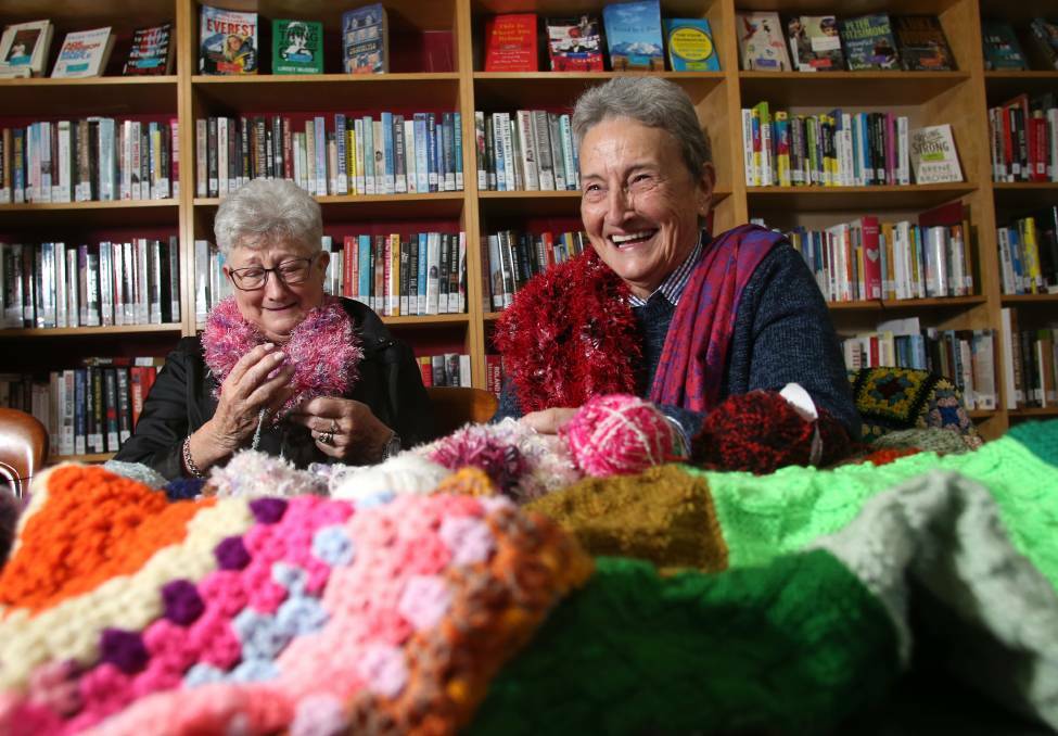 Dawn Brereton and Beth Gilbee crochet at the Eaglehawk Library to help those in need. Picture: GLENN DANIELS
