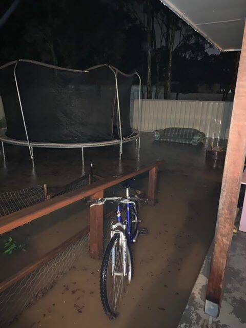 The yard of Peta Murphy's Kangaroo Flat home was inundated with flood water on Friday night. The resulting debris took hours to shift. Pictures: SUPPLIED