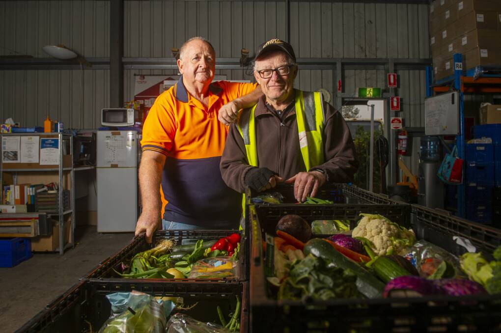 Bendigo Foodshare volunteers John Walker and Graeme Dower earlier this year. Picture: DARREN HOWE