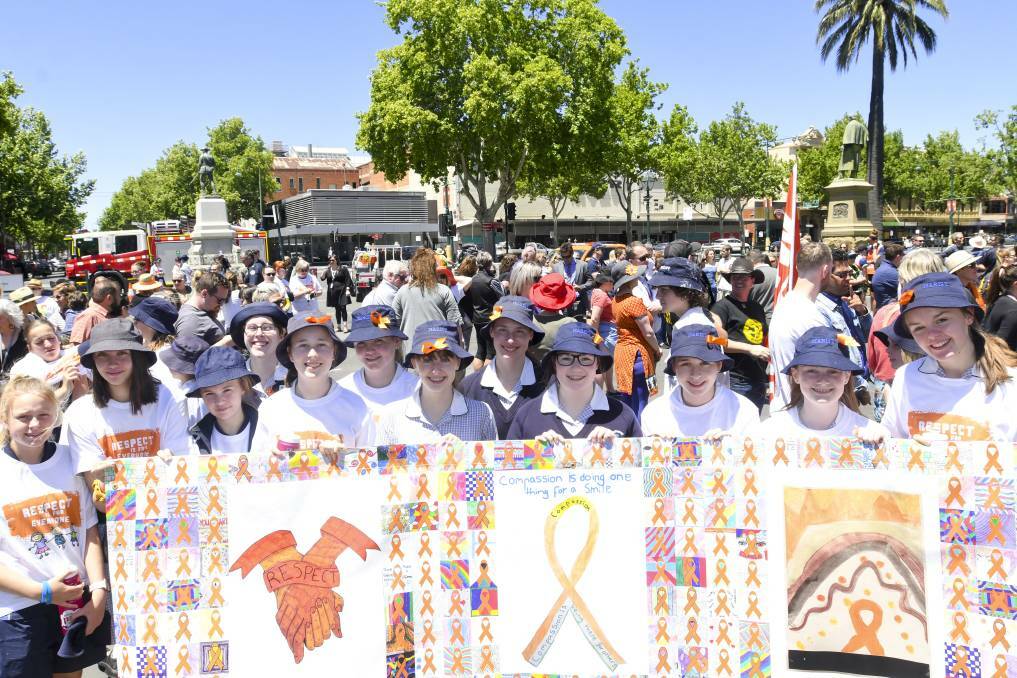 Marist College students leading the 2019 walk in Bendigo. To register for this year's virtual walk, click the picture. Picture: NONI HYETT