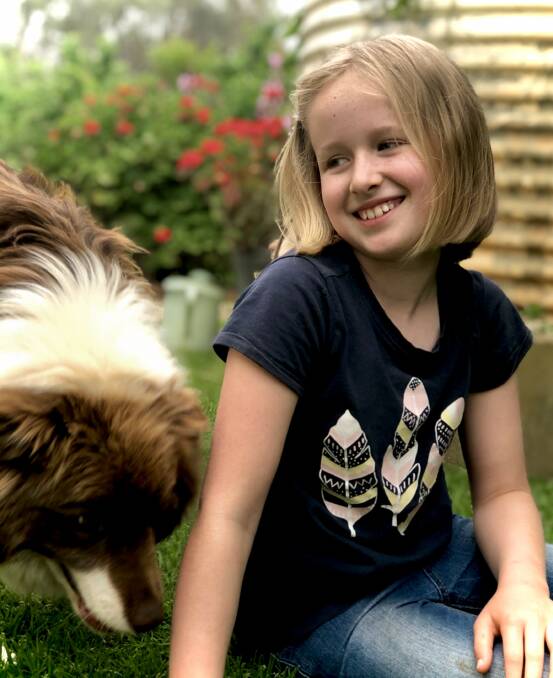 Ava Rudkins with her dog Rusty. Picture: SUPPLIED