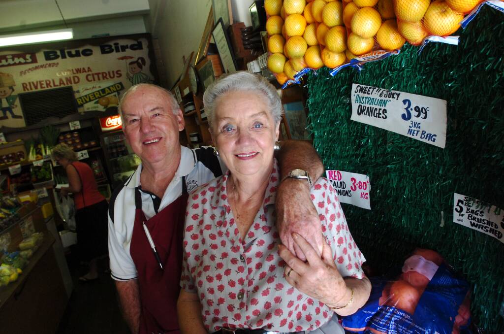 Norm and Gloria Quin in their fruit and vegetable store in 2007. Gloria died in 2011. Picture: ELLA PELLEGRINI