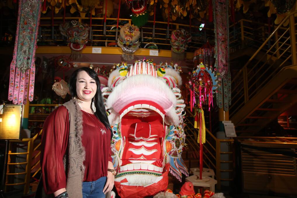 Felicity Brennan-Tong with Dai Gum Loong. Felicity is one of the dragon's head carriers. Picture: GLENN DANIELS