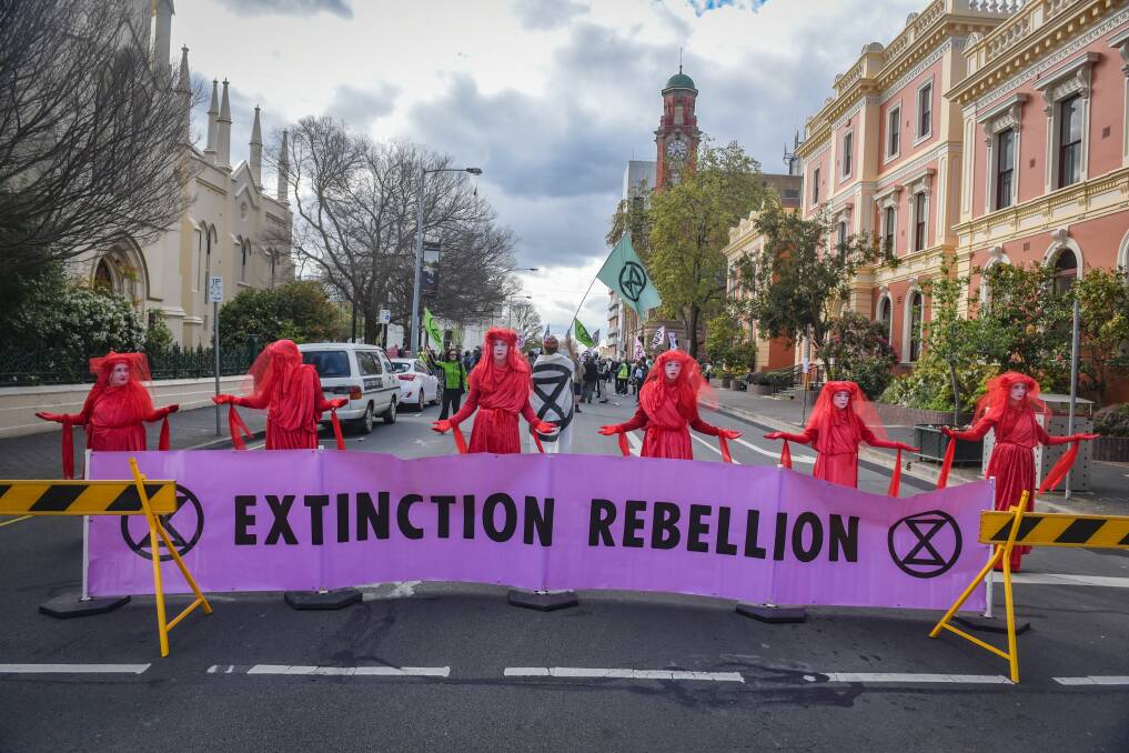 Members of the 'Red Brigade' block St John Street traffic on October 11. Picture: Paul Scambler 