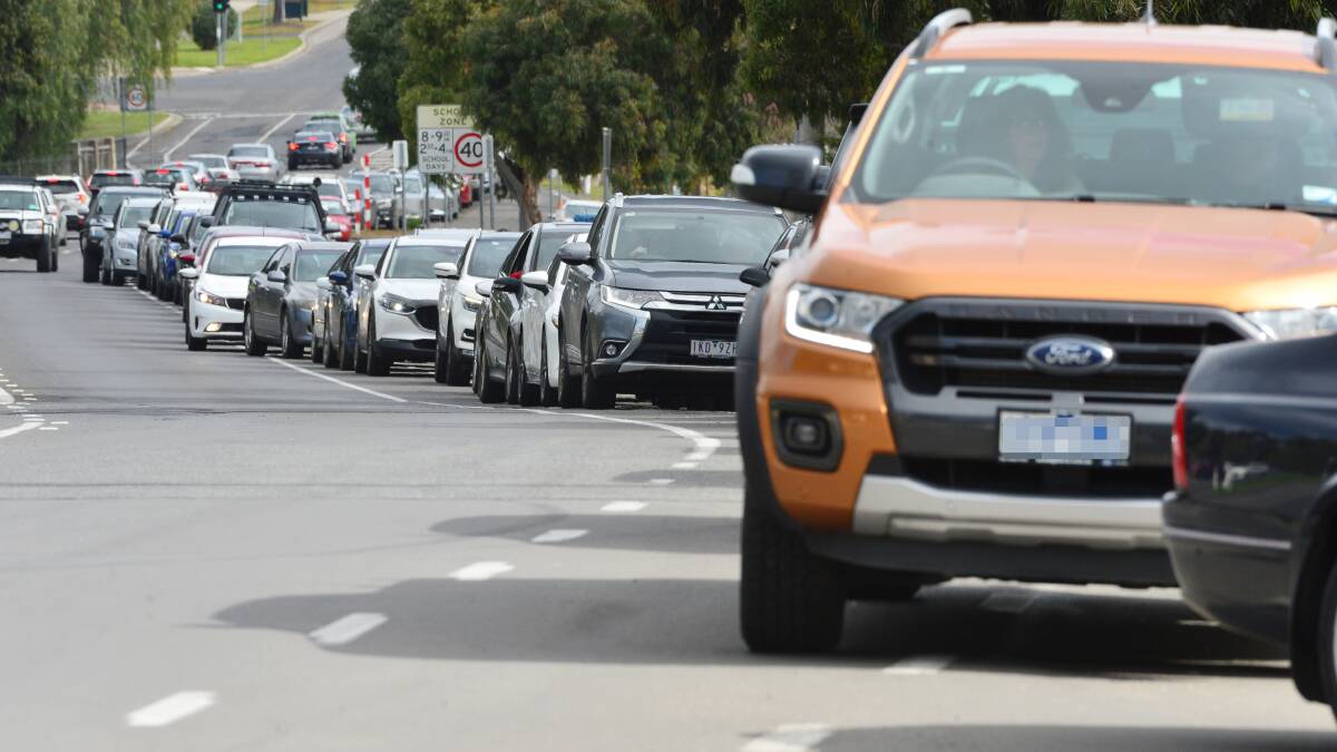 Vehicles queue as drivers wait to be tested in Bendigo. Picture: DARREN HOWE 