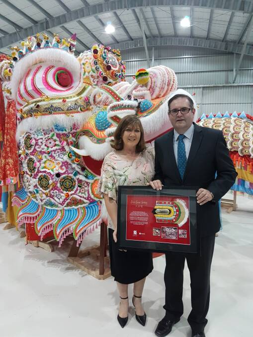 Simon Mulqueen (right) and wife Sue, at the 2019 arrival of Dai Gum Loong to Bendigo