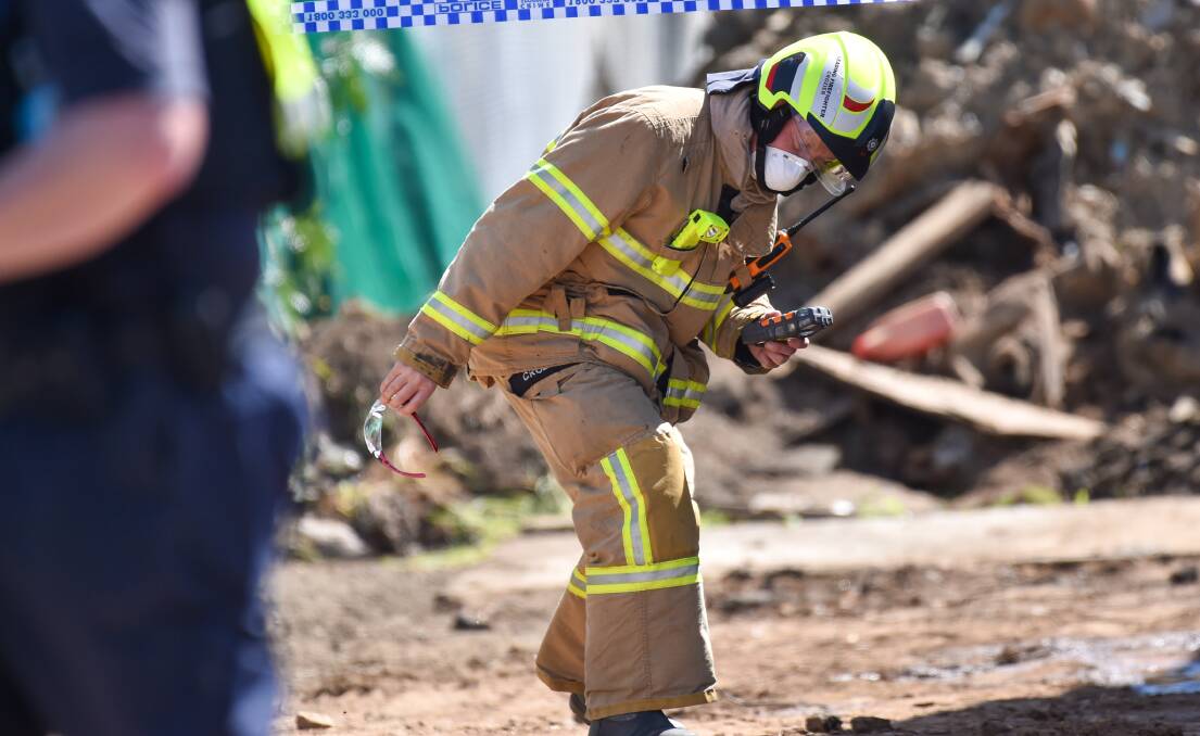 EXPLOSION: A firefighter at the scene of the 2020 workplace incident. Picture: DARREN HOWE 