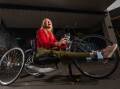 HAPPY: Sarah Cheshire and the newly restored bicycle she was given by Freewheeling Fun on Wednesday. Picture: DARREN HOWE