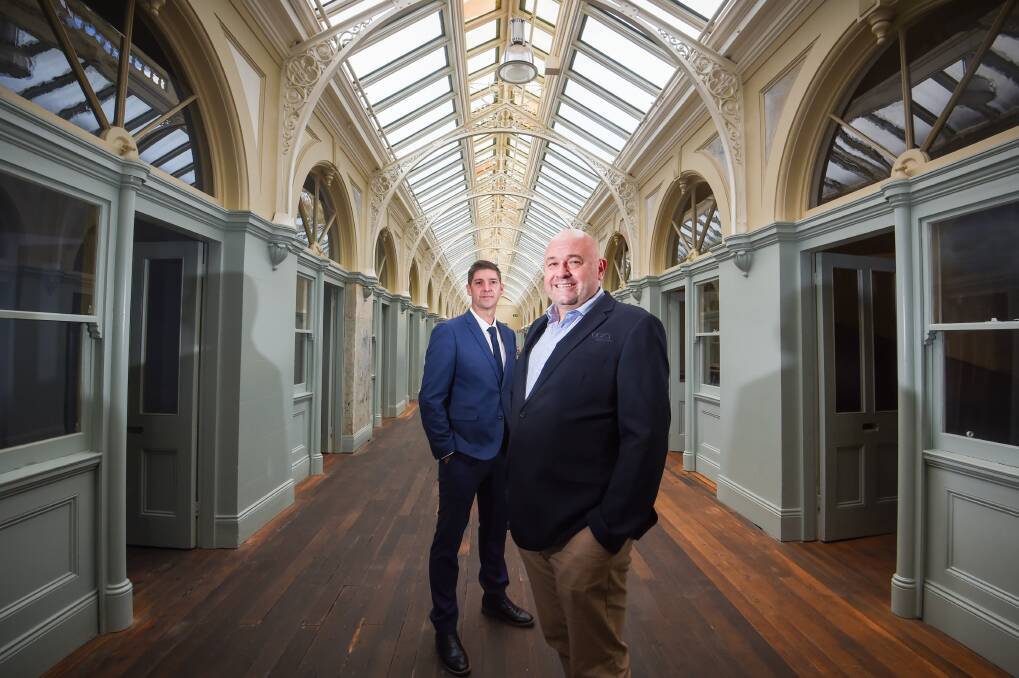 FOR SALE: The historic Beehive building on Pall Mall has been listed for sale. Pictured are agents Matt Bowles from DCK and Matt Jarrott from Colliers. Picture: DARREN HOWE