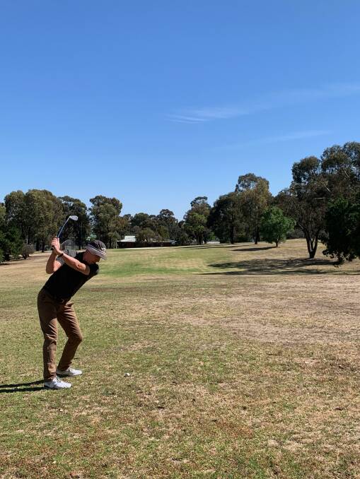 SWING AND A MISS: A lone golfer takes to the fairways at Quarry Hill golf club this week. 