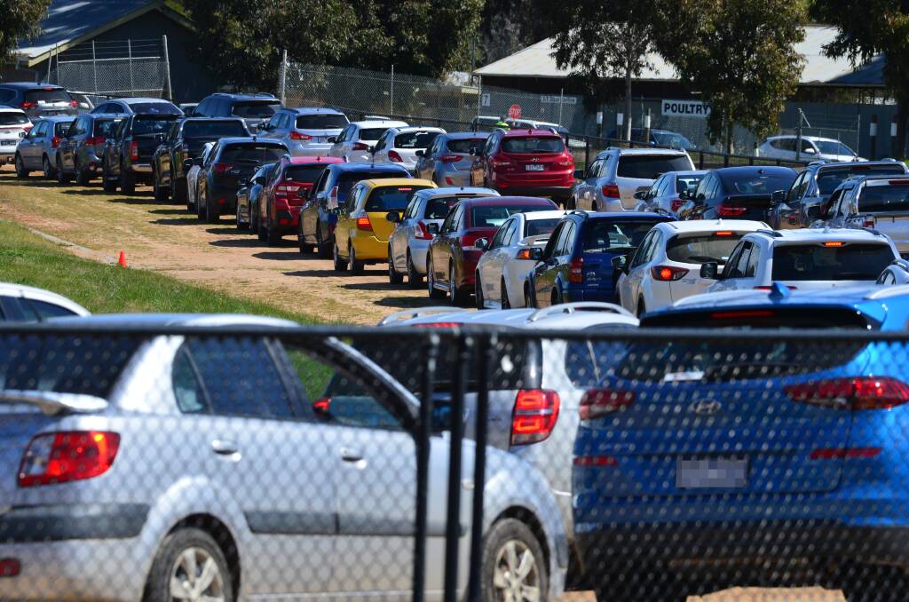 Vehicles line up at a temporary testing site at the Bendigo Showgrounds this week. Picture: DARREN HOWE 