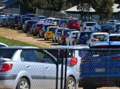 Vehicles line up at a temporary testing site at the Bendigo Showgrounds this week. Picture: DARREN HOWE 