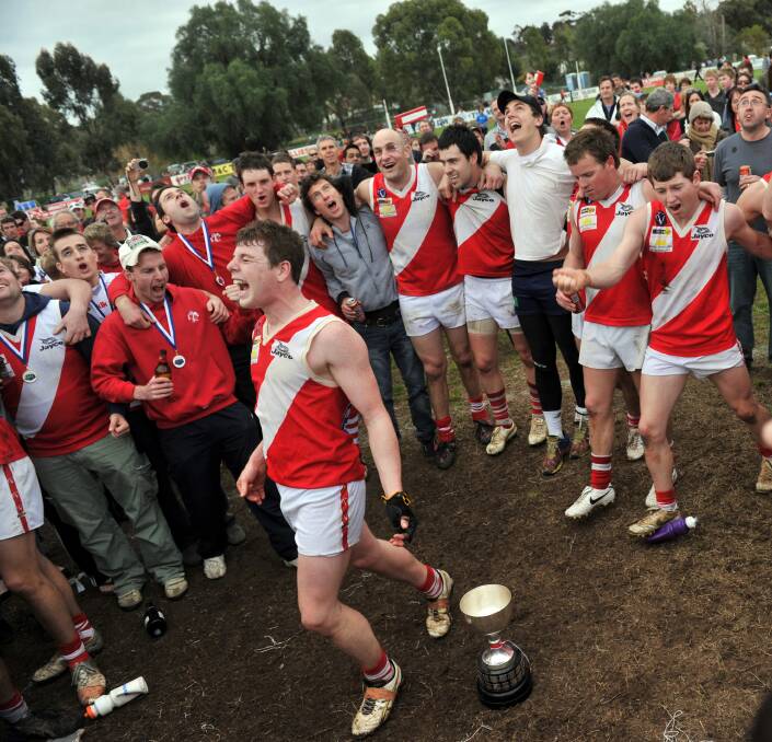START OF A DYNASTY: Bridgewater celebrates its 2010 premiership - the first of seven flags in a row the Mean Machine won during the decade.