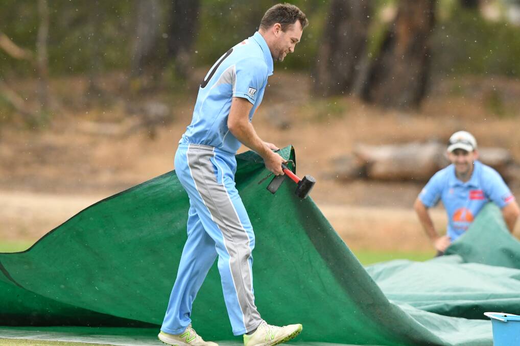 HAMMER TIME: Strathdale-Maristians' captain Ben DeAraugo puts his handyman skills to work with the covers on Saturday. Picture: NONI HYETT