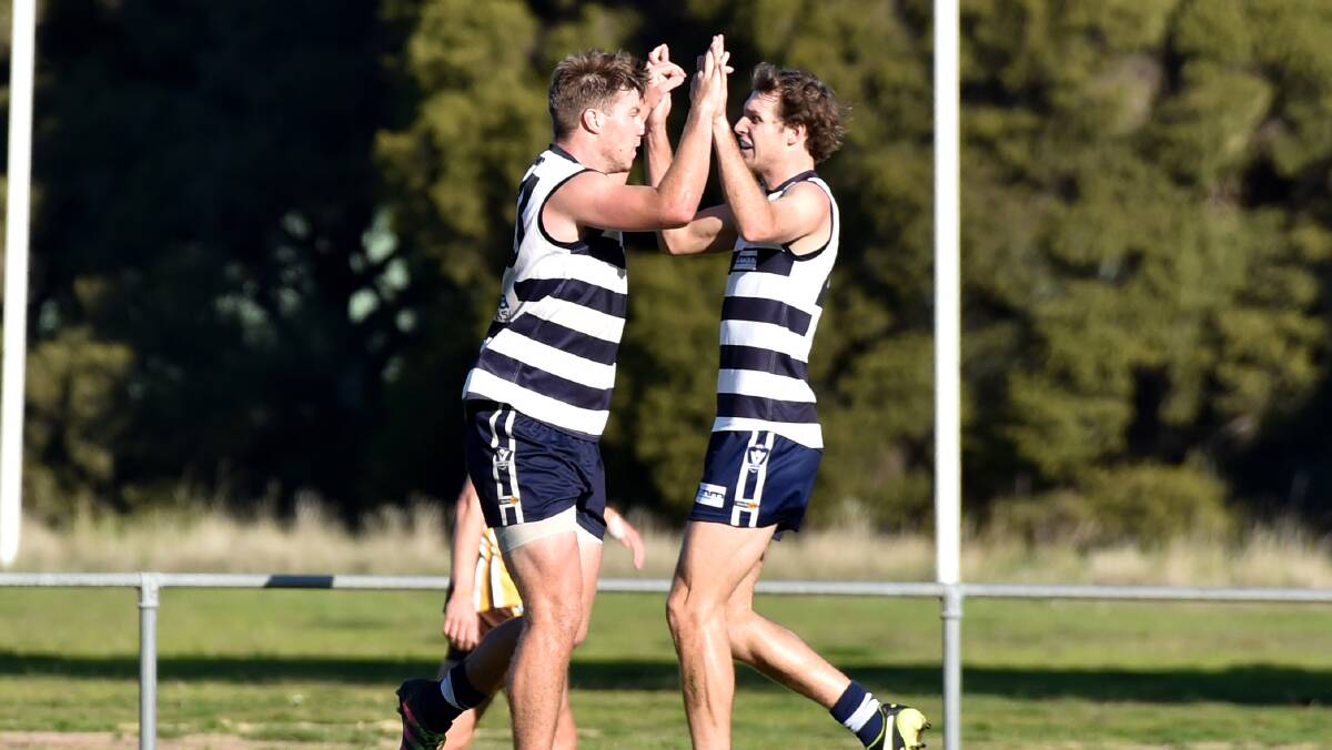 CATS PURRING: Lockington-Bamawm United's Thomas Leech and Jarod Bacon. The Cats have won six in a row ahead of Saturday's 1st v 2nd clash against North Bendigo.