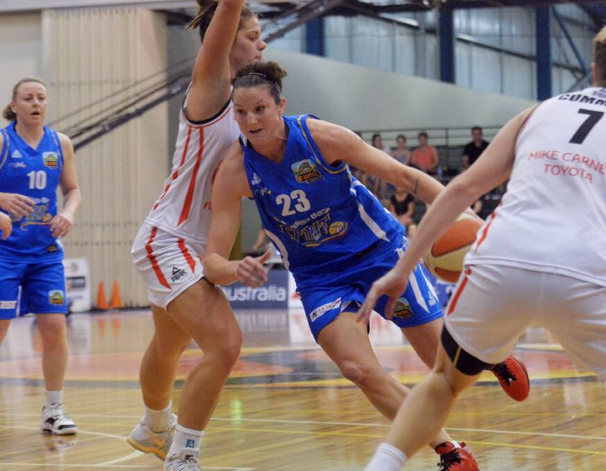 ON THE ATTACK: Kelsey Griffin drives to the basket for the Bendigo Spirit in the 2013-14 grand final against Townsville at the Bendigo Stadium.