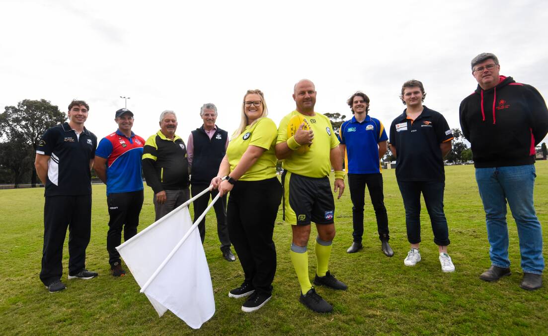 RESPECT: Bendigo Umpires Association members Ashleigh Hunter and Tom Nicholson flanked by members of AFL Central Victoria and club representatives. Picture: DARREN HOWE