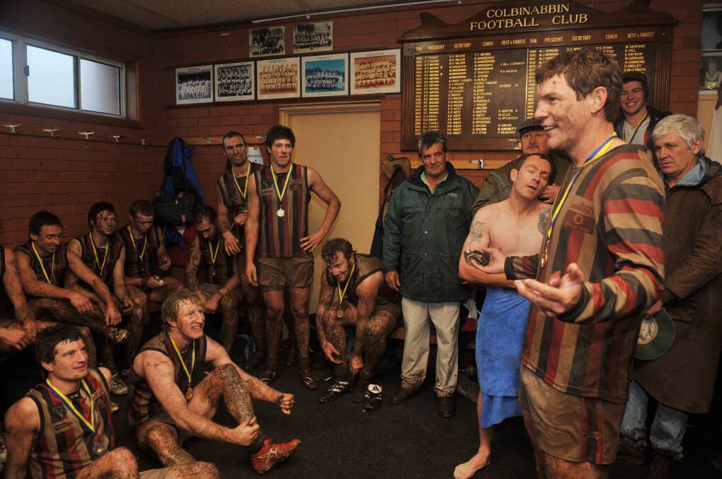 WELL DONE BOYS: Heathcote coach Brent Chapman addresses his players after their 2010 grand final win. The Saints also won the reserves flag that year.