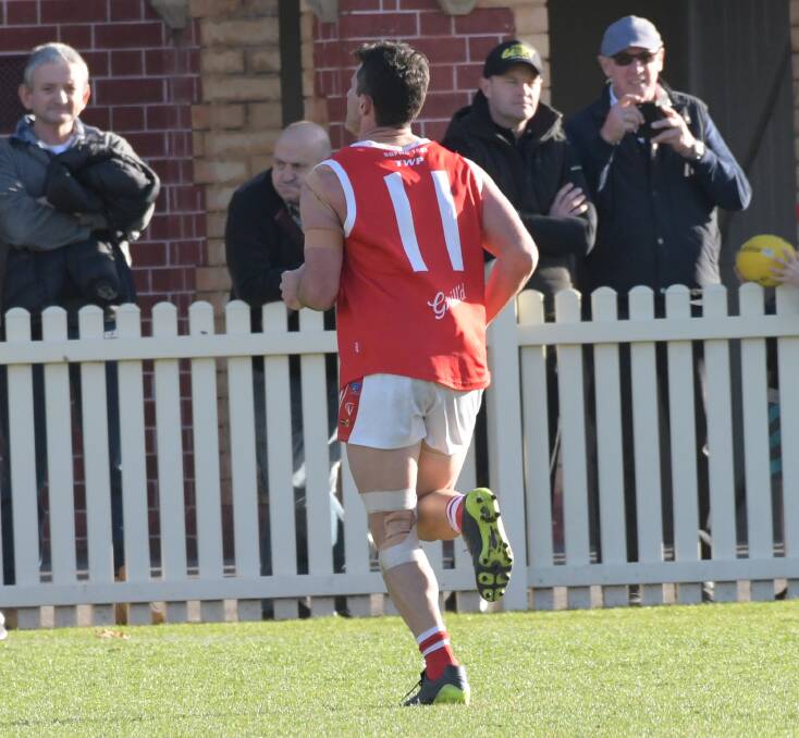 South Bendigo coach Brady Childs leaves the field after his report and yellow card last Saturday. Picture: NONI HYETT