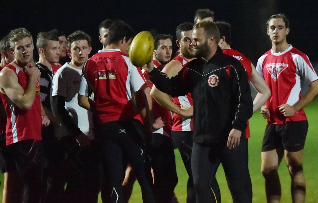PREPARATION: South Bendigo players at training at Harry Trott Oval on Tuesday night. The Bloods play Kyneton on Saturday. Picture: DARREN HOWE