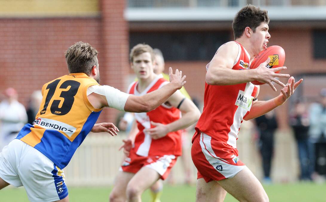 EVASIVE: South Bendigo's Isaiah Miller in action against Golden Square in round 16 - the day he suffered a season-ending kidney injury.