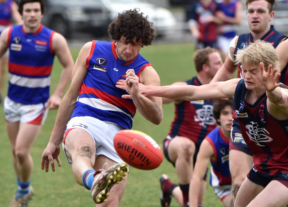 MIDFIELD GENERAL: Casey Summerfield in action for Gisborne in a game against Sandhurst at the QEO during the 2015 BFNL season. Summerfield is returning to the Bulldogs after three years at Macedon, which included winning a premiership in 2017.