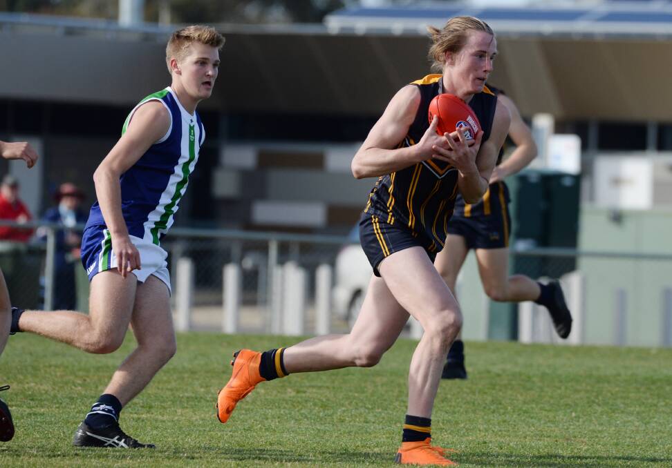 PACE: CMC's William Wallace shows plenty of speed during Wednesday's victory over Warrnambool. Wallace kicked three goals in the 71-point thrashing.
